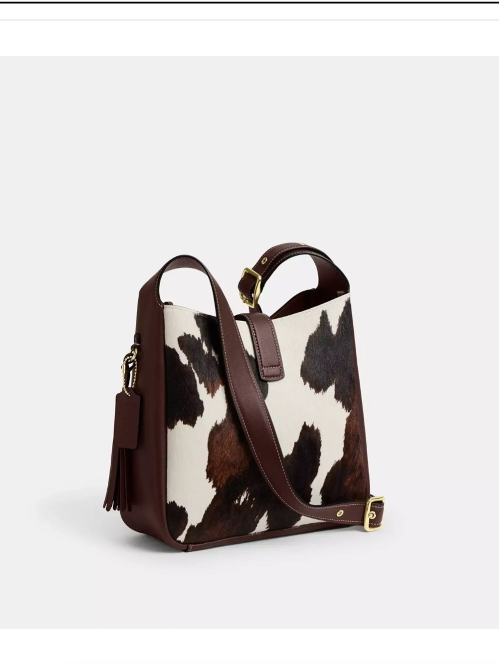 COACH HADLEY CONVERTIBLE
CROSSBODY BAG WITH COW
PRINT AND TASSEL - Picture 5 of 8